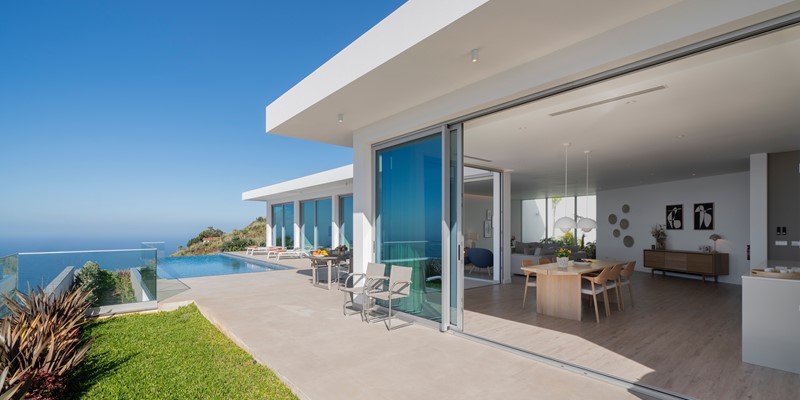 The Front Of Oceanair Luxury Villa In Madeira Showing The Spacious Living Area And The Inifinty Pool With Panoramic Seaview