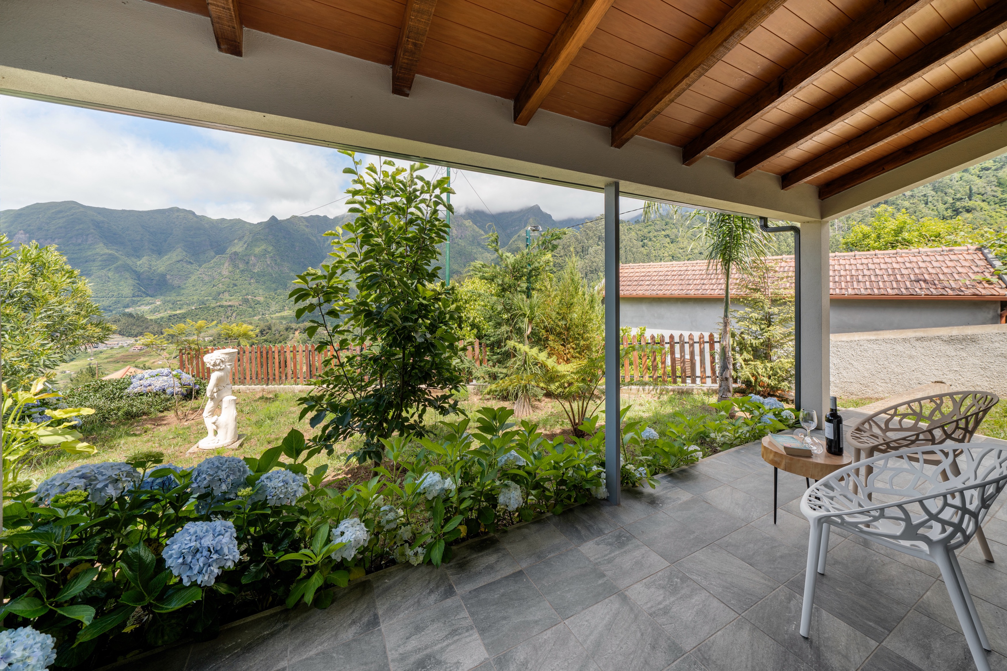 The Lovely Covered Veranda With Beautiful Views Of The Surrounding Mountains Of Sao Vicente At Casa Hortencia By Ourmadeira