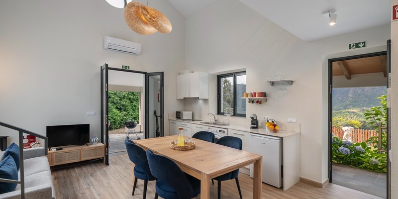 The Open Plan Living Area And Kitchen Of Casa Hortensia By Ourmadeira Showing The Views