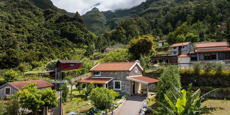 Villas In Madeira Showing Casa Hortensia By Ourmadeira With The Verdant Mountians In The Background