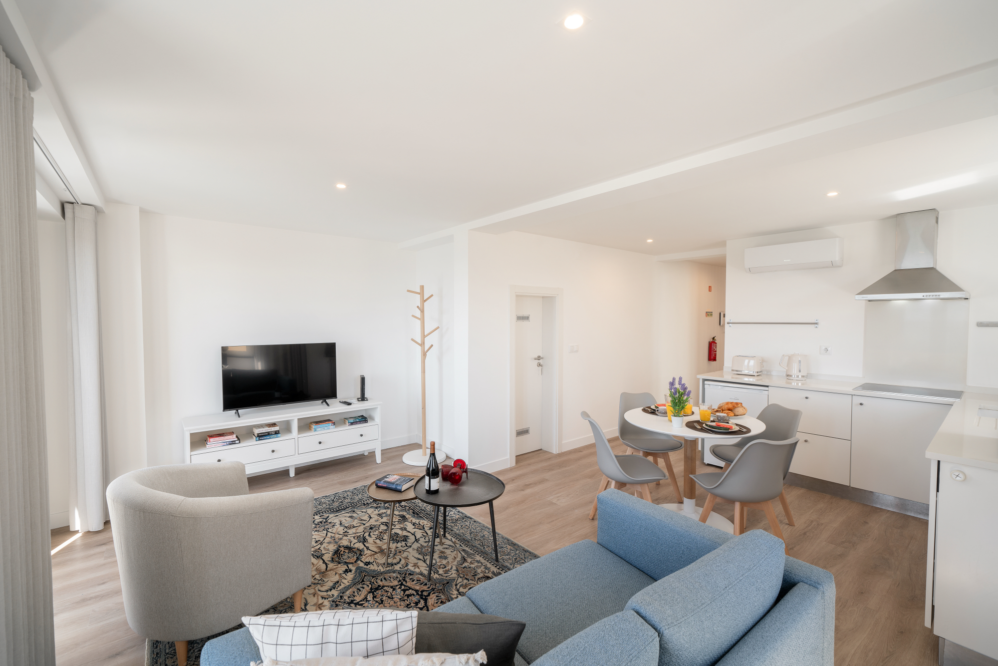 Ourmadeira Modern Living Room Showcasing A Blue Couch And A TV Creating A Welcoming Space For Relaxation And Fun The Fort Of Old Town