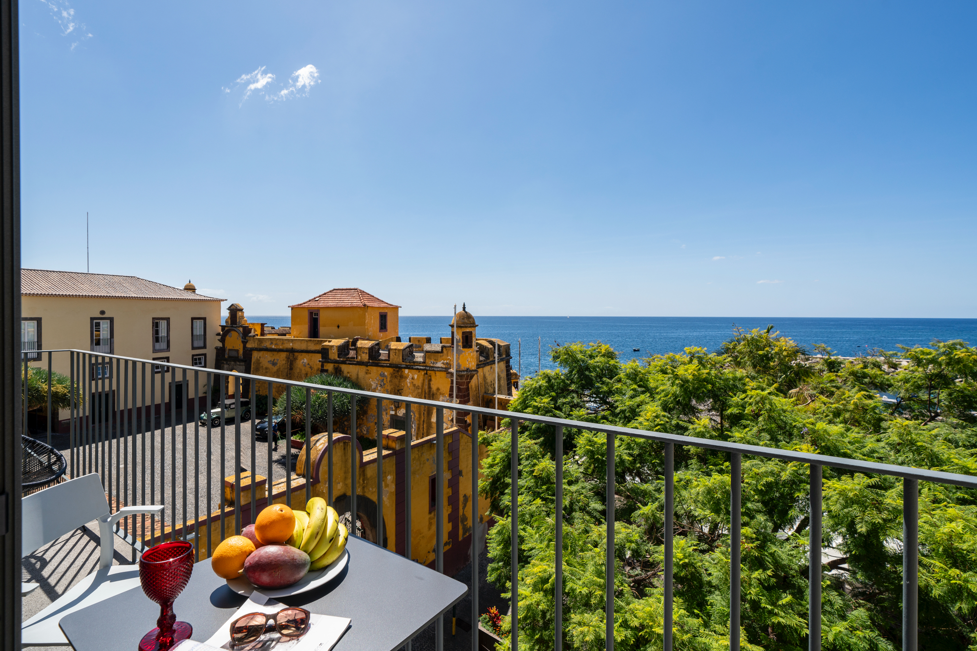 The Fort Of Old Town With A Delightful Balcony With A Table Filled With An Array Of Fresh Colorful Fruits Perfect For Enjoying The Outdoors And Seaview