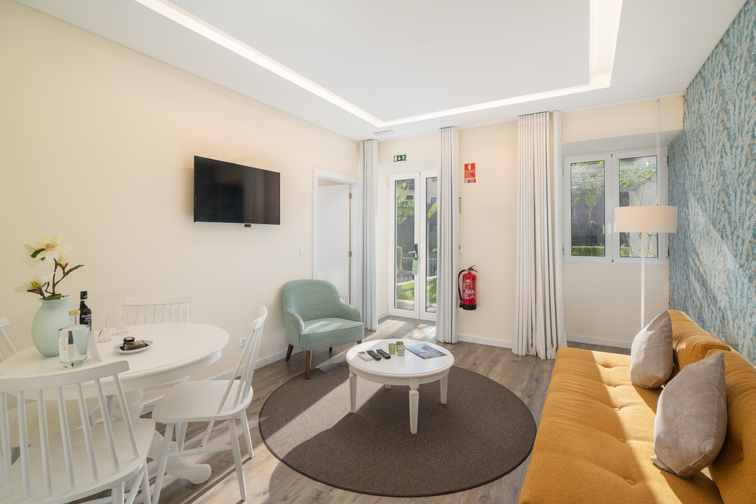 A View Of The Living Room And Outside Views At Babosas Village Garden Apartment 33 By Ourmadeira