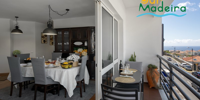 An Open Plan View Of The Dining Area And Front Veranda At Alamos Uptown Apartment In Funchal By Ourmadeira