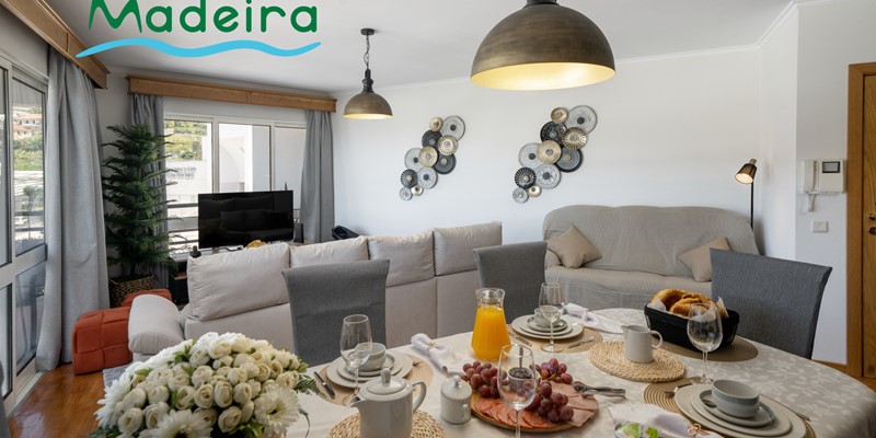The Cozy Dining And Living Area With Smart TV And Seatint For 6 At Alamos Uptown Apartment In Funchal By Ourmadeira