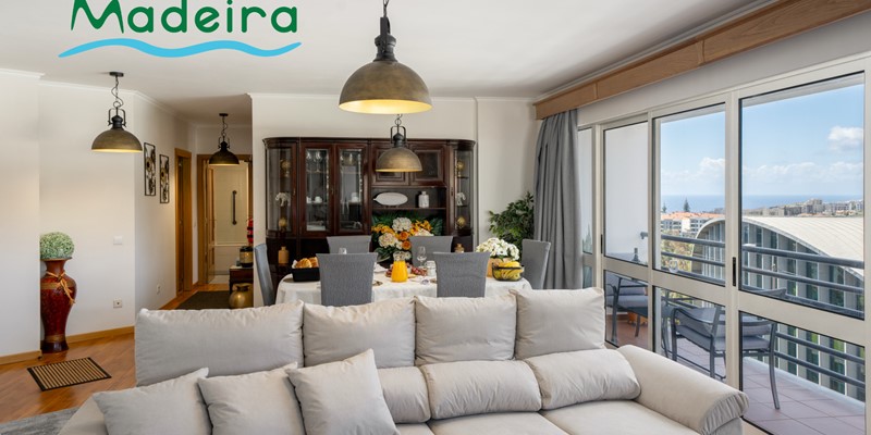The Light Living And Dining Area With Front Veranda At Alamos Uptown Apartment In Funchal By Ourmadeira