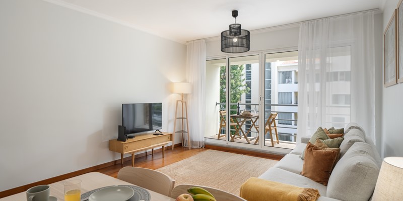 A Closer Look To The Open Plan Living Room With Balcony At Madalena Living By Ourmadeira