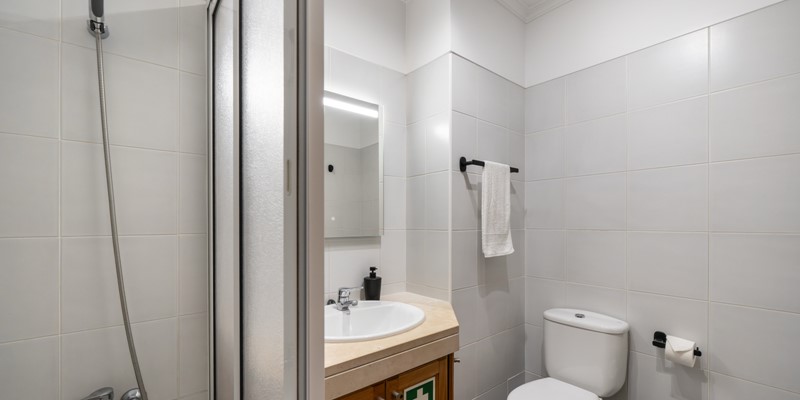 The Bathroom And Bath With Overhead Shower At Madalena Living By Ourmadeira