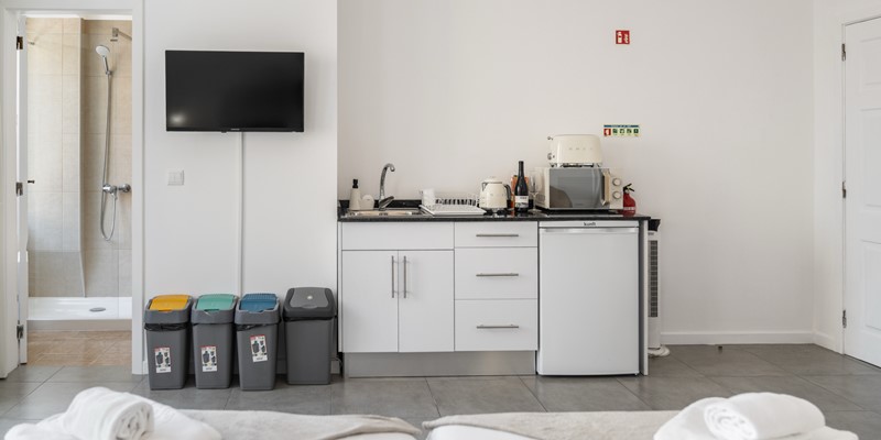 Breakfast Corner With Microwave Kettle Mini Fridgde And Toaster The Flat Screen TV And Walk In Shower At Apartamentos Taberna Studio 1 By Ourmadeira