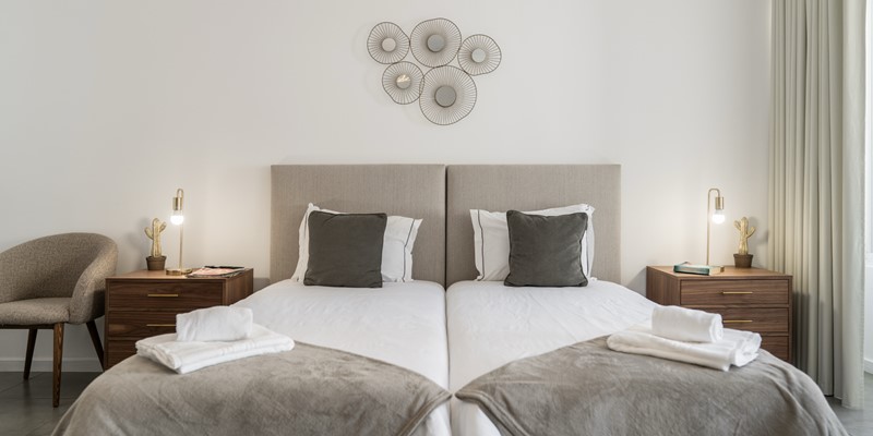 The Comfortable Twin Beds With Linen And Towels Provided At Apartamento Taberna Studio 1 By Ourmadeira