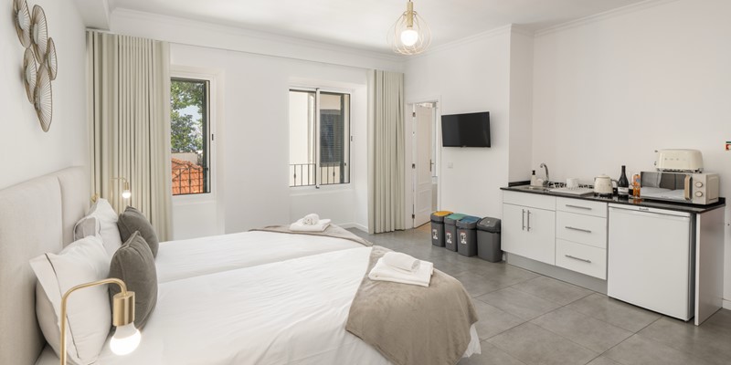 The Open Plan Studio With Breakfast Corner And Flat Smart Screen TV At Apartamentos Taberna Studio 1 By Ourmadeira