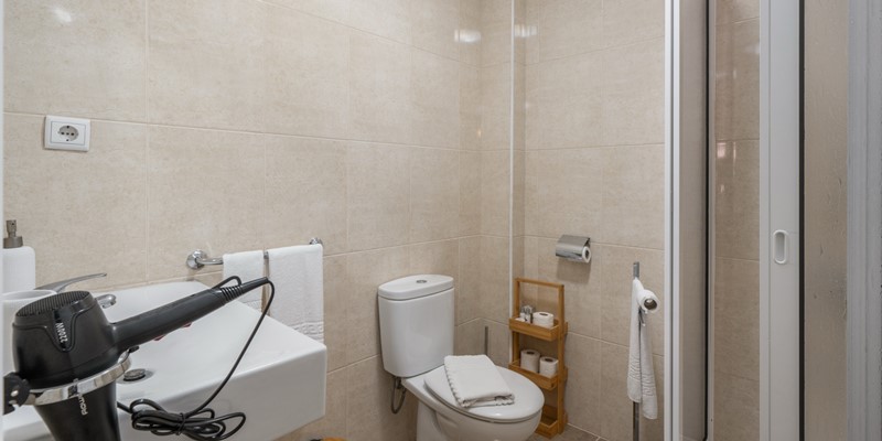The Bathroom With Walk In Shower Washbasin And Bidet At Apartamentos Taberna 2 By Ourmadeira