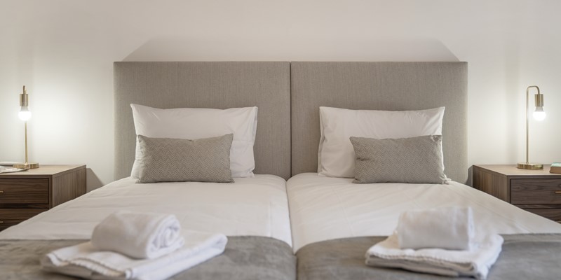 The Twin Beds With Linen And Towels Provided At Apartamentos Taberna Studio 2 By Ourmadeira