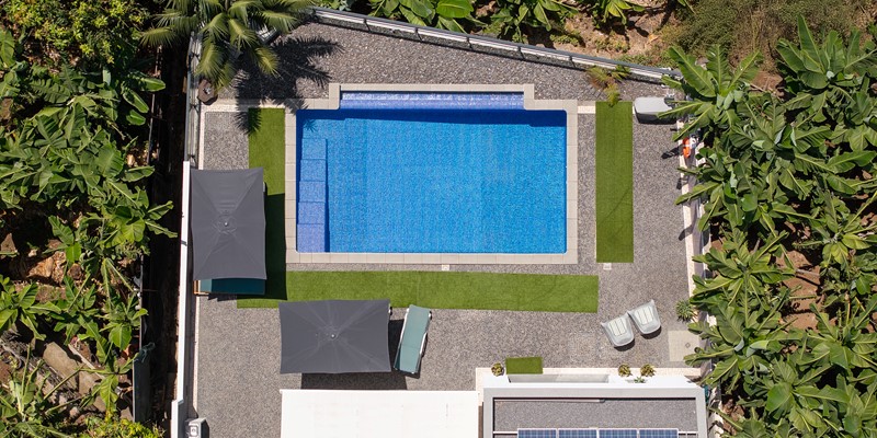 Drone View Of Graycis House By Ourmadeira Highlighting The Surrounding Banana Groves Architectural Layout Swimming Pool And Scenic Landscape Of Madeira Island