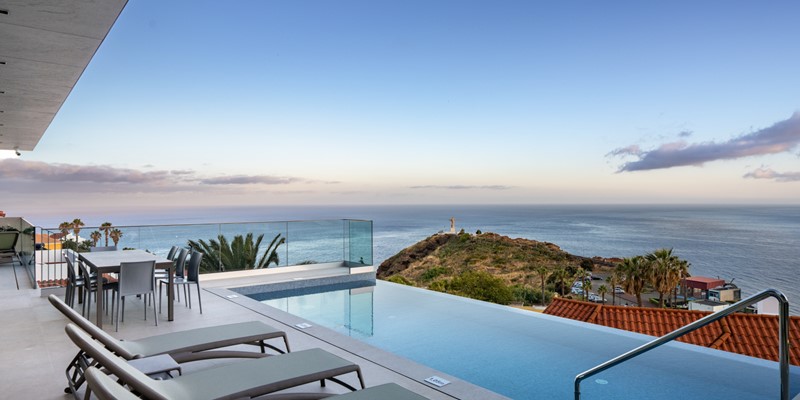The Breathtaking Sea Views And Infinity Pool At Sunset At Villa Grandview Cristo Rei By Ourmadeira