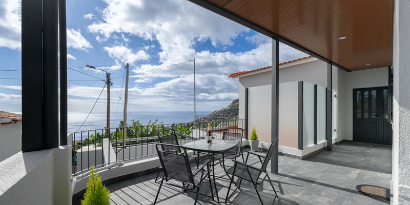 The Outdoor Seating With Sea View And View To Vineyards And Banana Trees At Casa Da Vinha By Ourmadeira