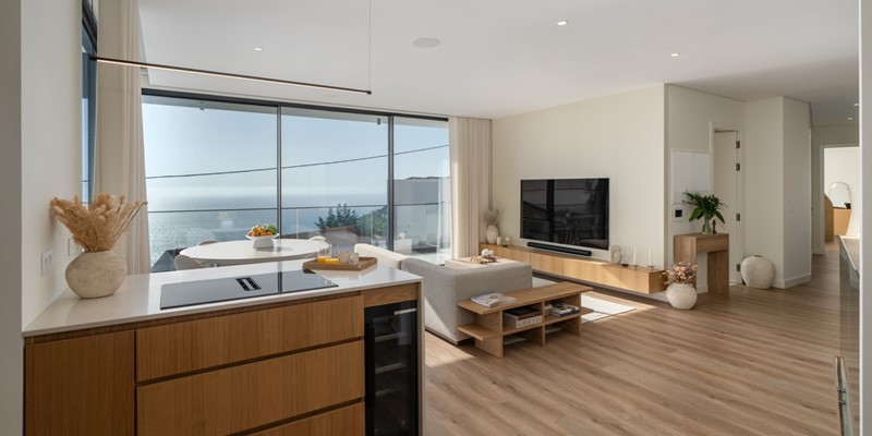 Elegant Open Concept Lounge And Dining Area With Sea Views And Modern Air Conditioning At Amani By Ourmadeira