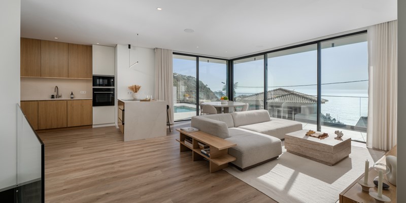 The Spacious Open Concept Living And Dining Area Bathed In Natural Light At Amani By Ourmadeira