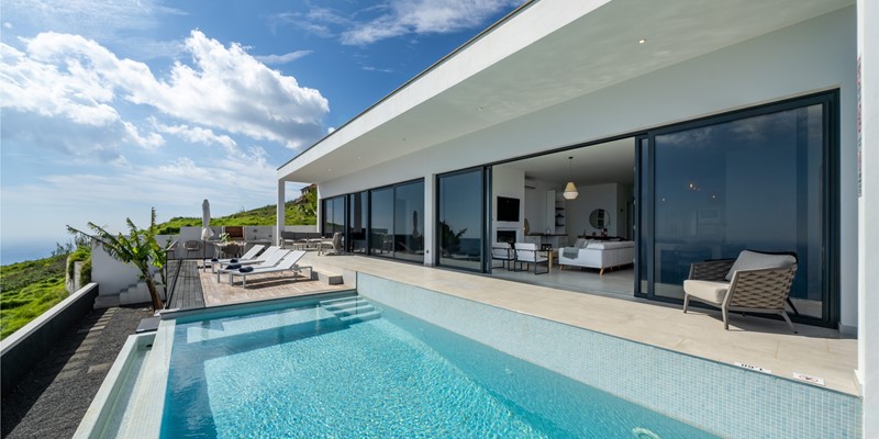 Infinity Pool At Infinite Atlantic By Ourmadeira With The Modern Villa As A Backdrop And Panoramic Atlantic Ocean Views In Madeira