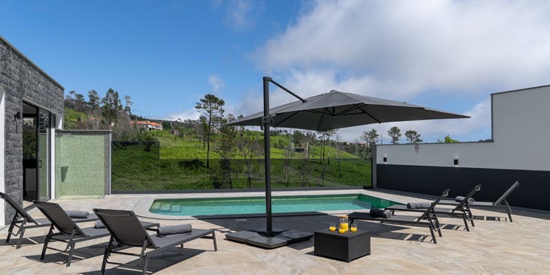 The Large Pool Deck With Sun Umbrellas Shower And Countryside Views At Casa Da Leonor By Ourmadeira
