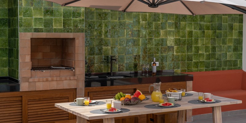 A Dedicated Barbecue Area With Outdoor Dining Ideal For Al Fresco Meals At Casa Da Tia By Ourmadeira